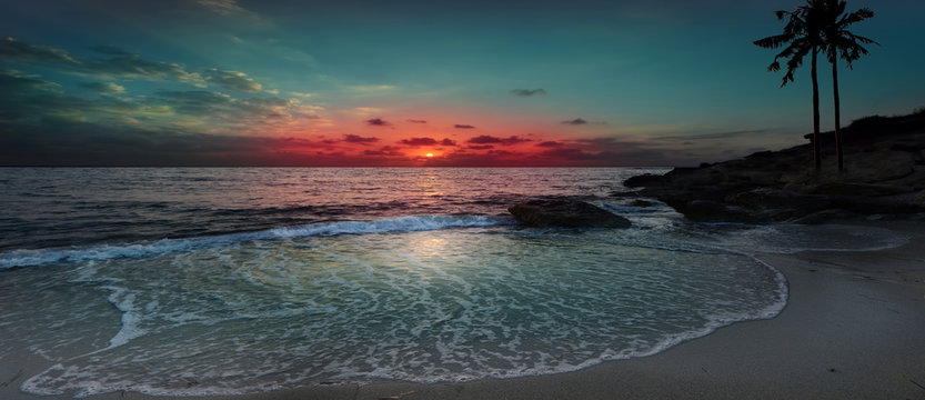 Beautiful sunset on the wave beach.