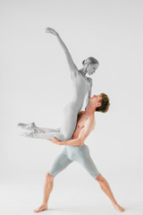 Couple of young and athletic ballet dancers retouched in color and black and white
