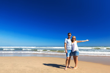 Happy couple spend time on the beach.