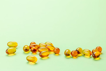 Close up of Vitamin D3 Omega 3 fish oil capsules.