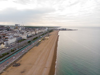 Aerial photo of the Brighton beach and coastal area located in the south coast of England UK that is part of the City of Brighton and Hove, taken on a bright sunny day