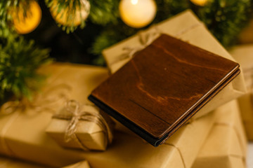 Fototapeta premium wooden book with christmas decoration on wooden background