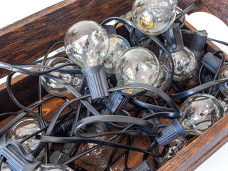 Old wooden box full of light bulbs