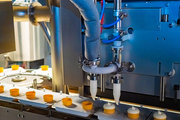 Creamy ice cream production. Ice cream spill conveyor line. Frozen Yogurt Factory. Recycling milk products.Natural Milk product. The conveyor in the food industry.Processing line for the food industry