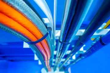 Production wiring. Electrical wiring in technical rooms. Electric wires are fastened by a plastic...