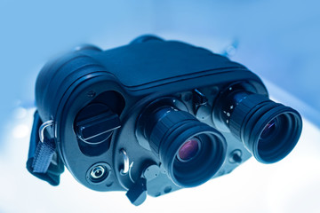 Binoculars with a range finder. Binoculars with night vision device. Observation from a distance. Advanced equipment for remote observation. Military Commune. Spy's equipment.Ammunition for the hunter