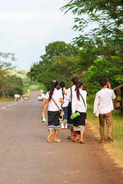 A Group Of Laotian High School Walking Home From School.