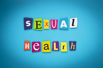 Writing text - sexual health. Colorful letters on a blue background. Heading, message, poster. Self-care concept. Multicolored inscription on banner. Multicolored title.