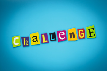 A word writing text - challenge. Colored letters on a blue background. Headline. Banner with inscription. Self development concept.
