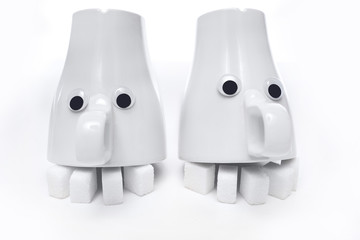 Emoji out of the cups. The concept of harm from the use of sugar. The abuse of sugar. Sweet tooth. A metaphor for unhealthy eating. The concept of possible harm from sucrose