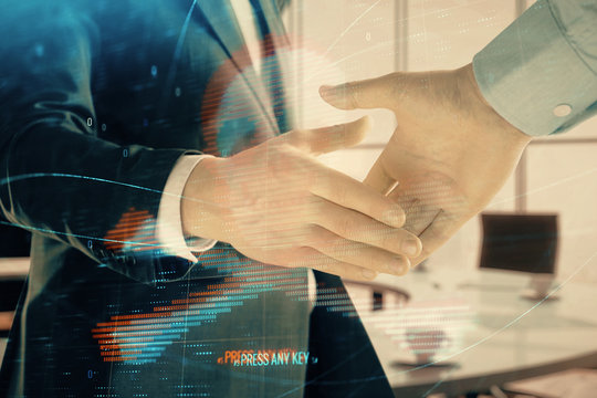Double exposure of hacking theme hologram on office background with two men handshake. Concept of data security