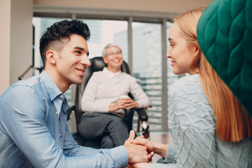 Fototapeta premium Consultation of couple young man and woman patient on reception for psychologist. Family problems