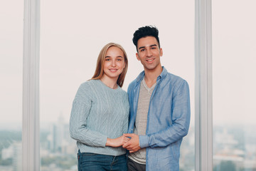 Happy young couple. Positive man and woman portrait. Hug and happy.