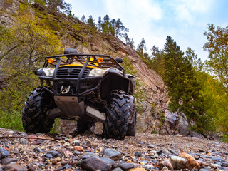 Sports ATV. Quadrocycle on a rocky road. Quad bike close-up. ATV control.Riding on Quad bike services. Buying a sports ATV.Spare parts for quadrocycle.Rent a quadrocycle. Extreme hobby. Extreme travel © Grispb