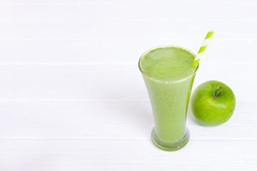Apple smoothie green juice beverage healthy the taste yummy in glass for on white wood background.