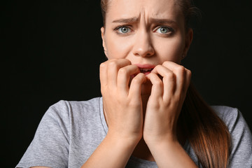 Woman having panic attack on dark background
