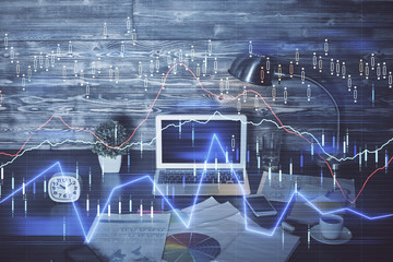Multi exposure of chart and financial info and work space with computer background. Concept of...