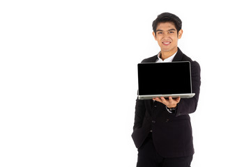 Handsome young businessman Asian caucasian wear a black suit with black hair, be a smile and standing smart poses. Hold and show a computer laptop. On a white background.