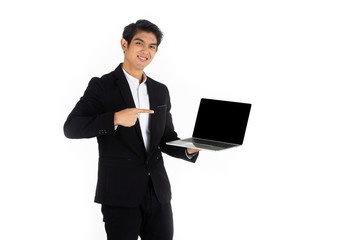 Handsome young businessman Asian caucasian wear a black suit with black hair, be a smile and standing smart poses. Hold and show a computer laptop. On a white background.