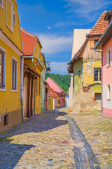 Fototapeta na wymiar Small colorful street in medieval city