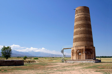 The famous Burana Tower in Kyrgyzstan against a blue sky