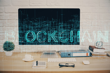 Double exposure of blockchain and crypto economy theme hologram and table with computer background. Concept of bitcoin cryptocurrency.