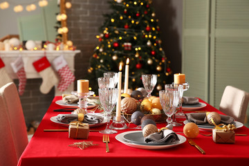 Festive table setting for Christmas dinner at home