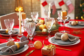 Festive table setting for Christmas dinner at home