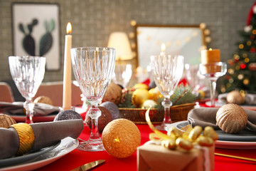 Festive table setting for Christmas dinner at home