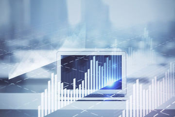 Forex graph hologram on table with computer background. Multi exposure. Concept of financial markets.