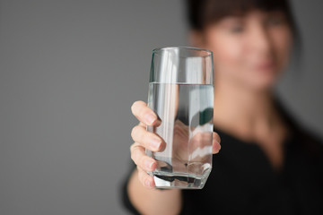 woman holds a glass of water in her hands. Office. Businessman. Close-up