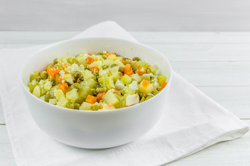 Russian salad Olivier with potato carrot green peas