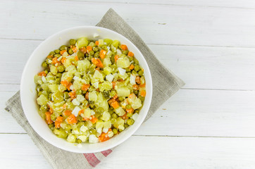 Russian salad Olivier with potato carrot green peas