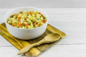 Russian salad Olivier with potato carrot green peas
