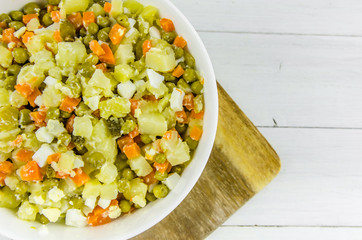 Russian salad Olivier with potato carrot green peas