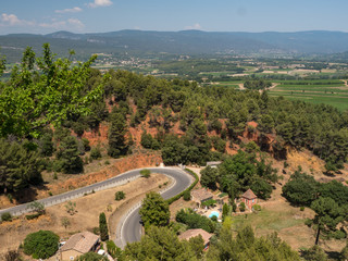 ROUSSILLON, France, august 2019: A view of the red ochre cliffs of Roussillon, ranked as one of the...