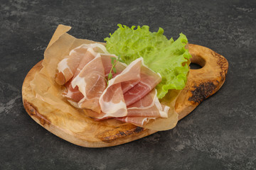 Italian prosciutto pork meat over board