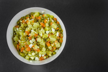 Russian salad Olivier with potato carrot green peas