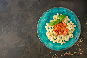 pasta tomato sauce and sausages (Cavatappi, Elbow, Campanelle) serving second course. top food background. copy space