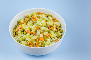 Russian salad Olivier with potato carrot green peas