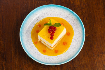Traditional Cheesecake with orange sauce
