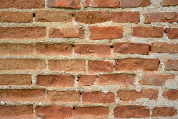 Old red brick wall background.
