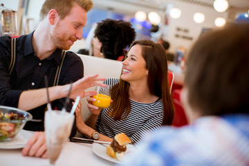 Friends eating at the table in the diner
