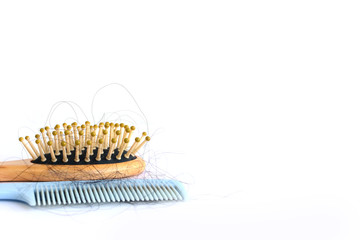 Obraz premium Hair loss, hair loss every day, serious problems and hair loss on a white background.