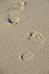 footprints on the sand summer walk