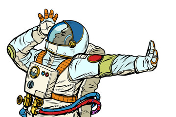 Astronaut in a spacesuit. Gesture of denial, shame, no