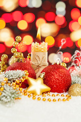 Background Christmas. Xmas composition with candle, green Xmas tree branch and New Year decoration