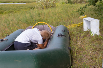 A child is preparing an inflatable boat