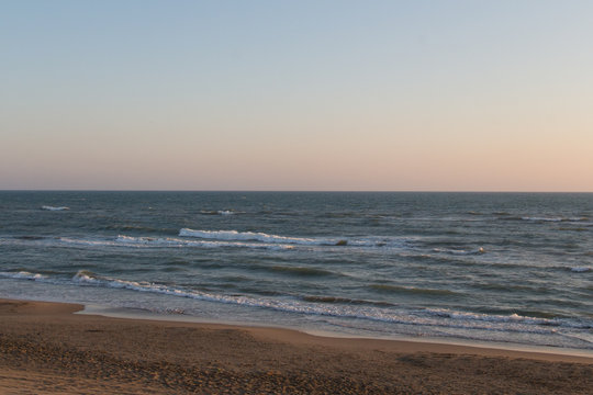 Twilight on Tyrrhenian sea. Sunset on a beach.