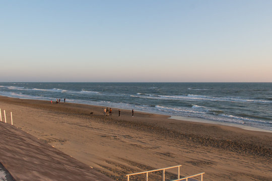 People walking on a beach. Tyrrhenian sea.